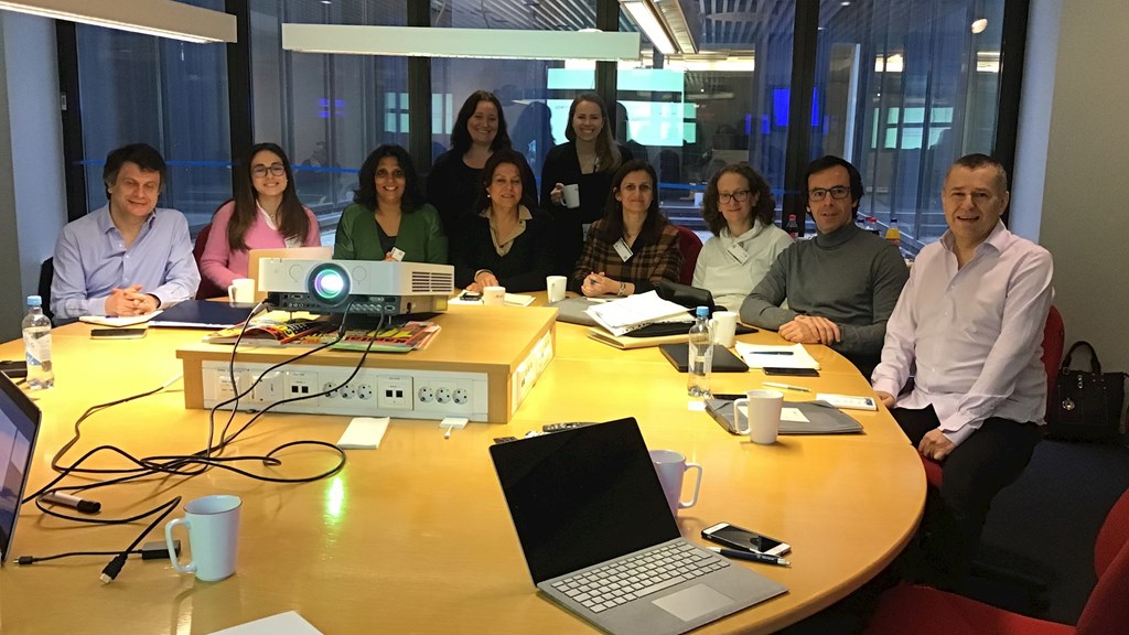 Several people from the company sitting around a table